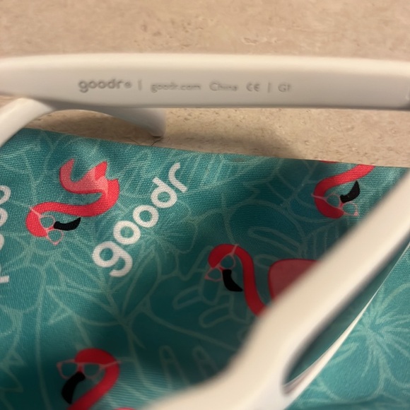 Goodr Side scroll eye roll white frames with a purple tint. Medium size frame - Picture 4 of 7